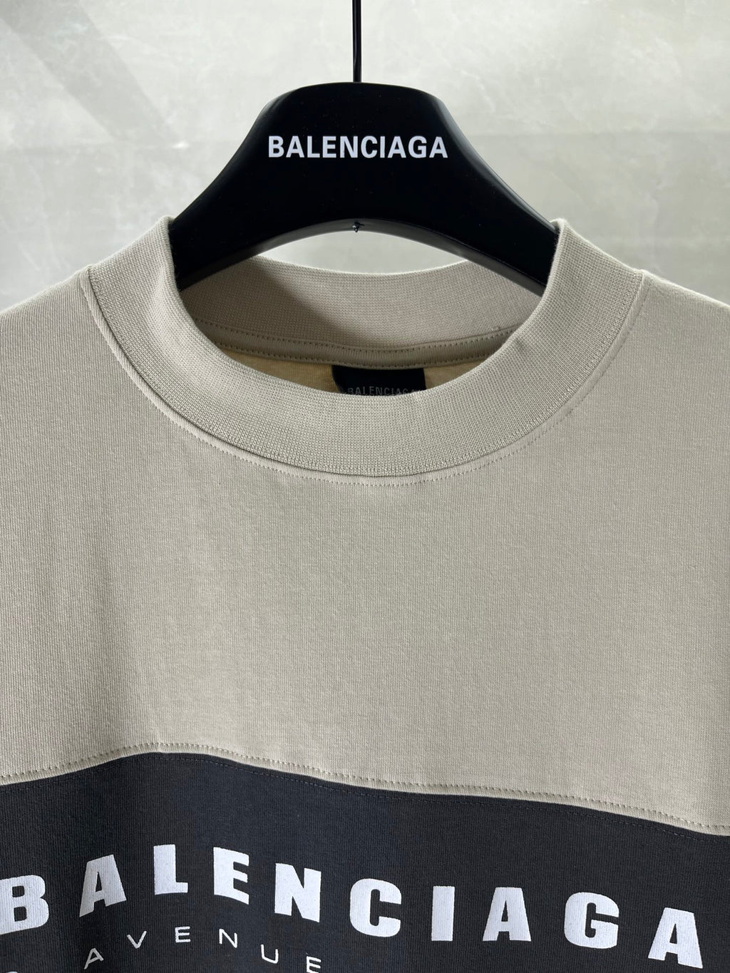 Balenciaga crewneck T-shirt neckline with white logo print on dark top panel