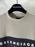 Balenciaga crewneck T-shirt neckline with white logo print on dark top panel