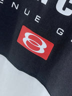 Balenciaga logo patch detail on dark T-shirt fabric