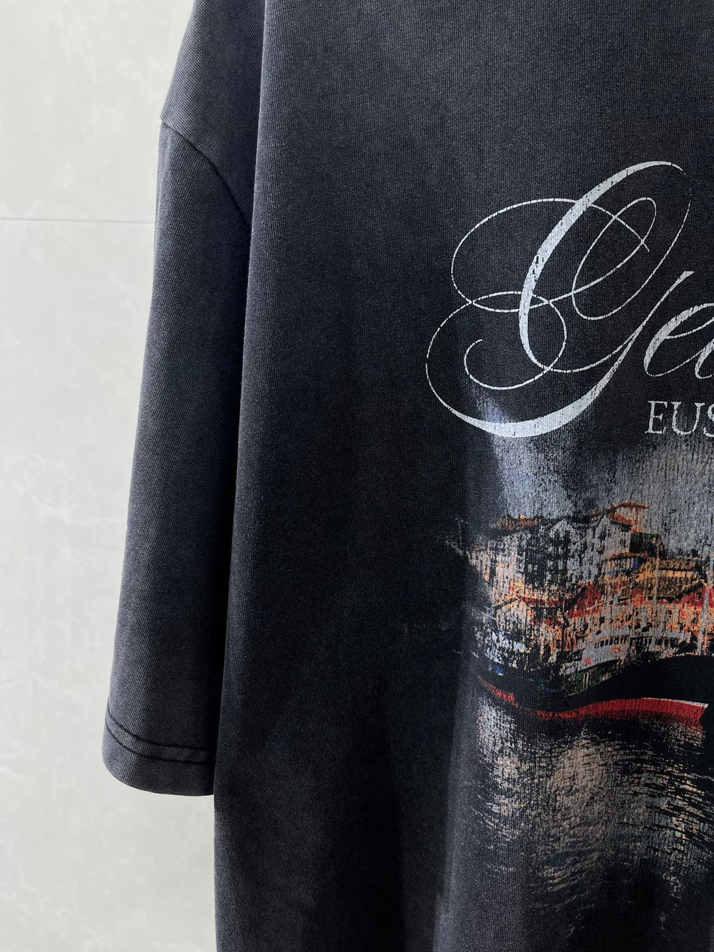 Navy T-shirt with Getaria EUSKADI graphic and cityscape print detail.