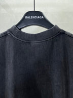 Navy crewneck T-shirt neckline close-up on hanger, plain front.