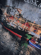 Navy T-shirt close-up of multicolor EUSKADI cityscape with curved red/green bands.