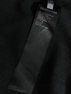 Inner neck label on dark T-shirt with Balenciaga branding