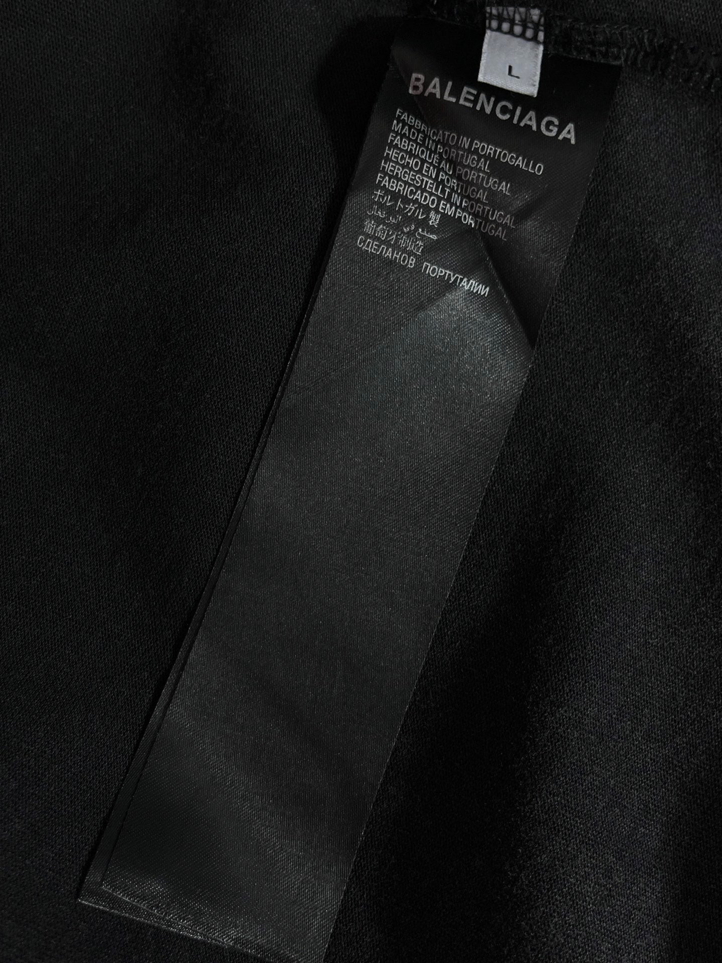 Inner neck label on dark T-shirt with Balenciaga branding