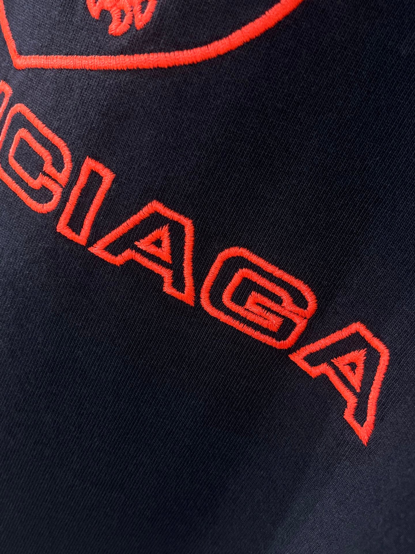 Navy Balenciaga T-shirt close-up of red 'BALENCIAGA' lettering
