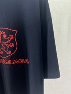 Navy Balenciaga T-shirt sleeve and hem detail with red logo lettering