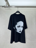 Black short-sleeve T-shirt with large face graphic front