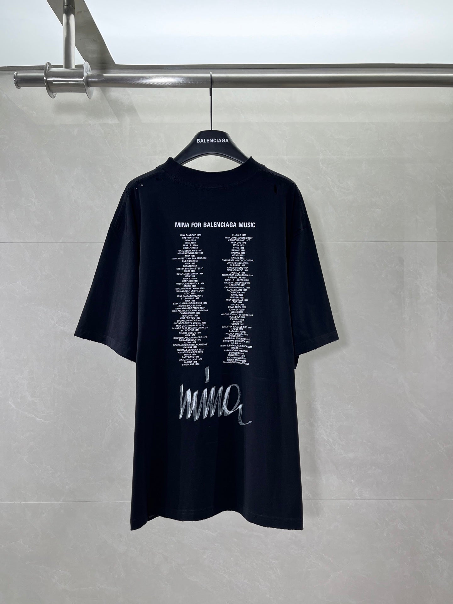 Black short-sleeve T-shirt with back typography text and Wings logo