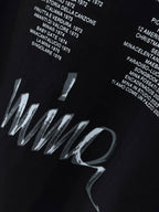 Black short-sleeve T-shirt back with large cursive Wings text