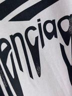 Balenciaga logo T-shirt close-up of black lettering print on light gray