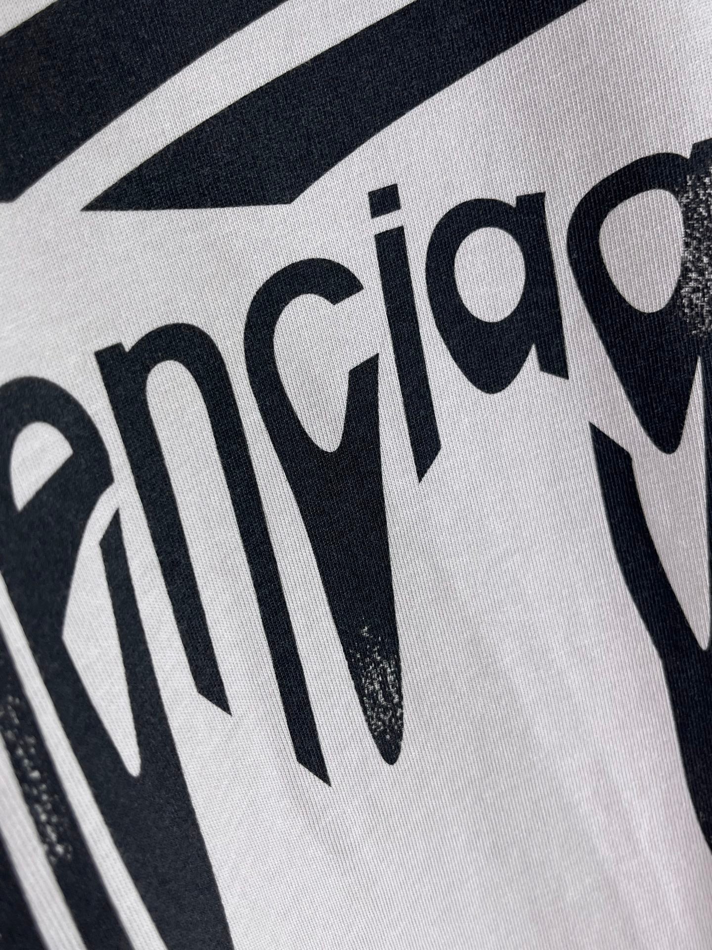 Balenciaga logo T-shirt close-up of black lettering print on light gray