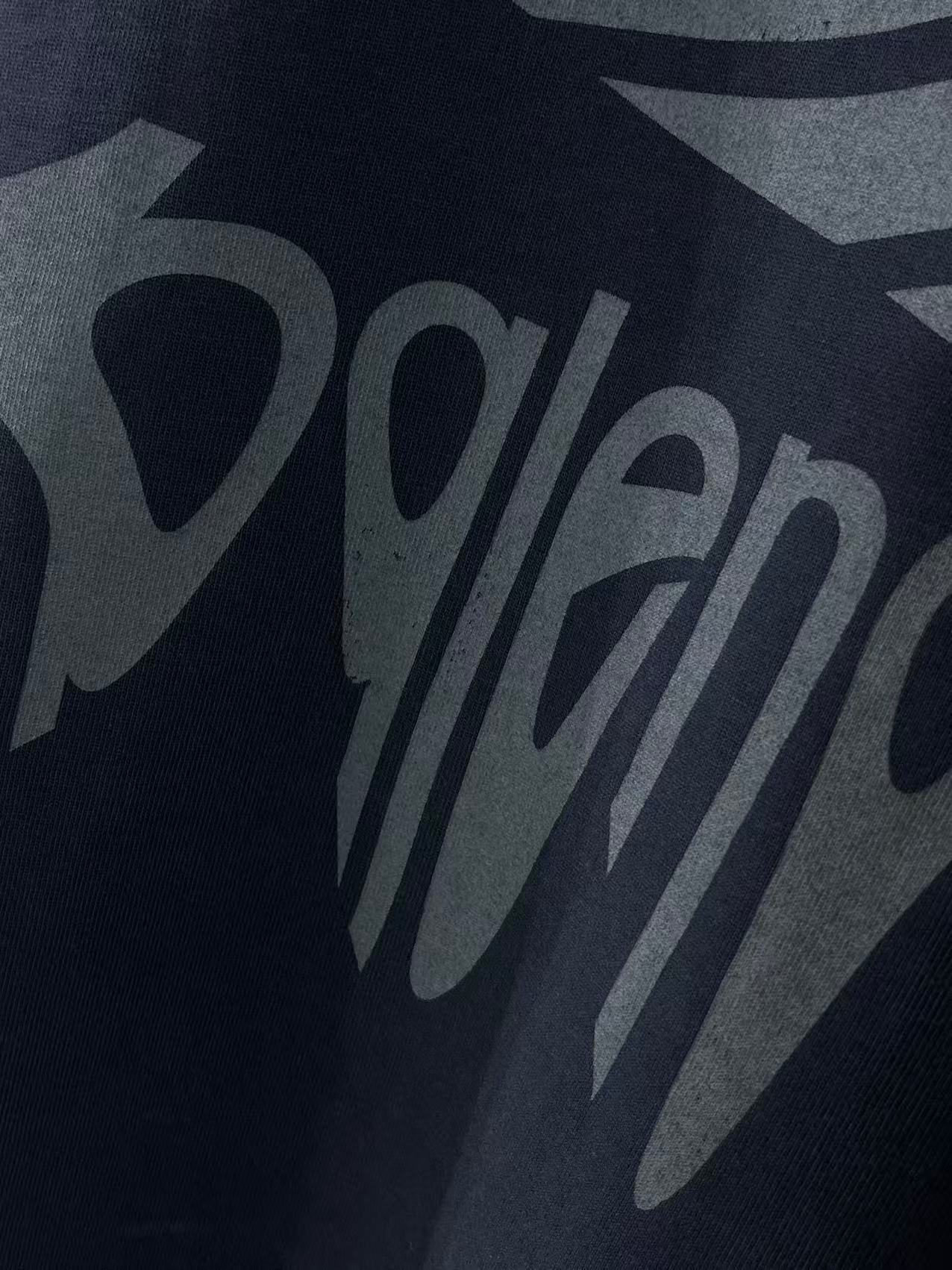 Navy Balenciaga T-shirt front logo graphic lettering close-up.