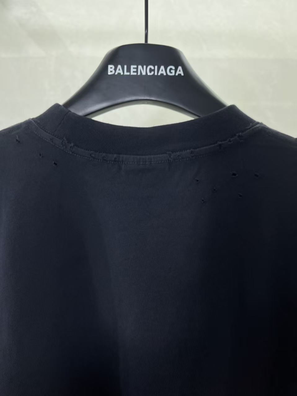 Navy Balenciaga T-shirt crew neck with subtle distressed marks near collar.