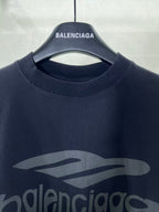 Navy Balenciaga T-shirt crew neck with large front logo graphic close-up.