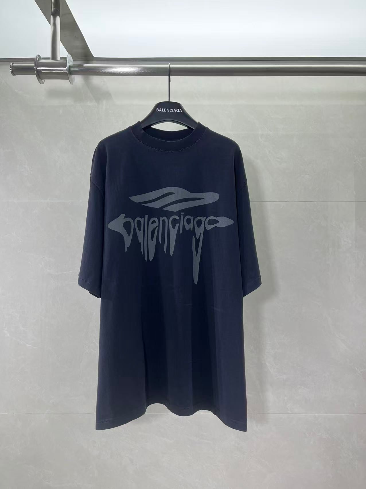 Navy Balenciaga T-shirt with large front logo graphic and crew neck.