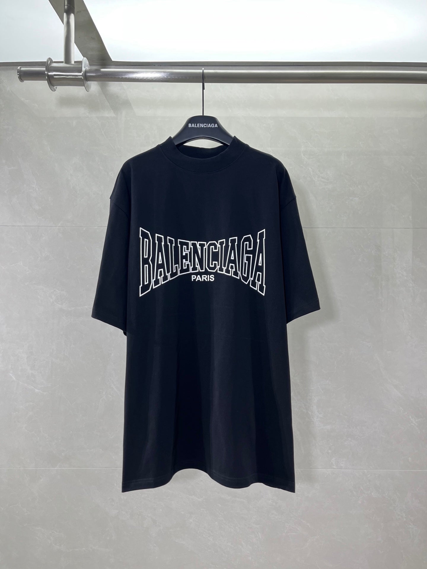 Navy short-sleeve T-shirt with Balenciaga graphic logo at chest