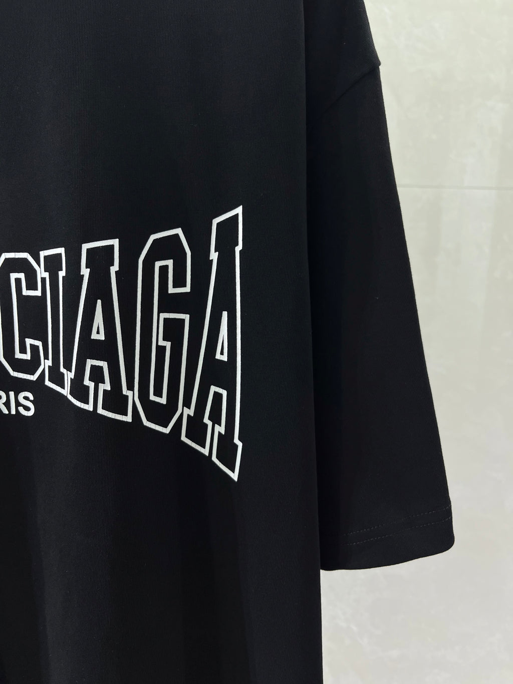 Navy T-shirt with partial Balenciaga PARIS wordmark graphic