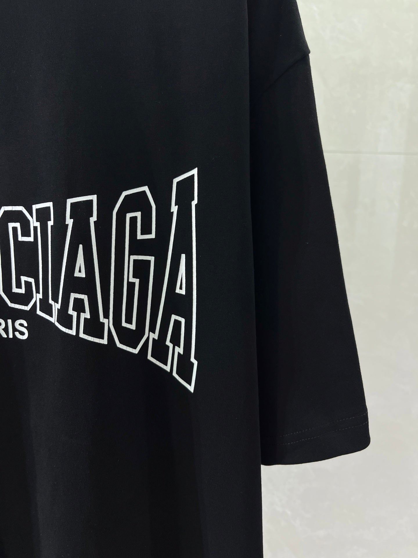 Navy T-shirt with partial Balenciaga PARIS wordmark graphic