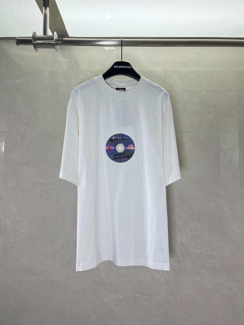 White Balenciaga T-shirt with short sleeves and round neckline, featuring a colorful disc graphic
