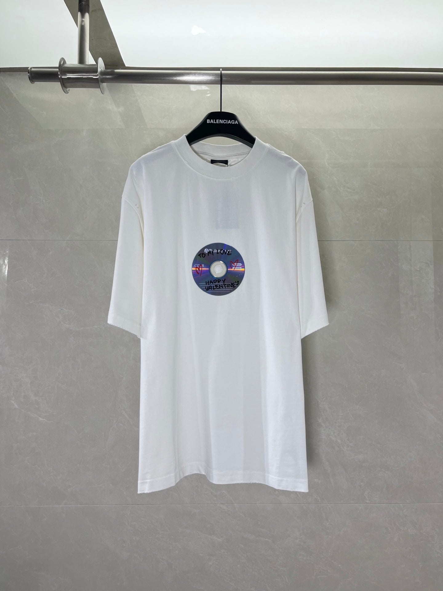 White Balenciaga T-shirt with short sleeves and round neckline, featuring a colorful disc graphic