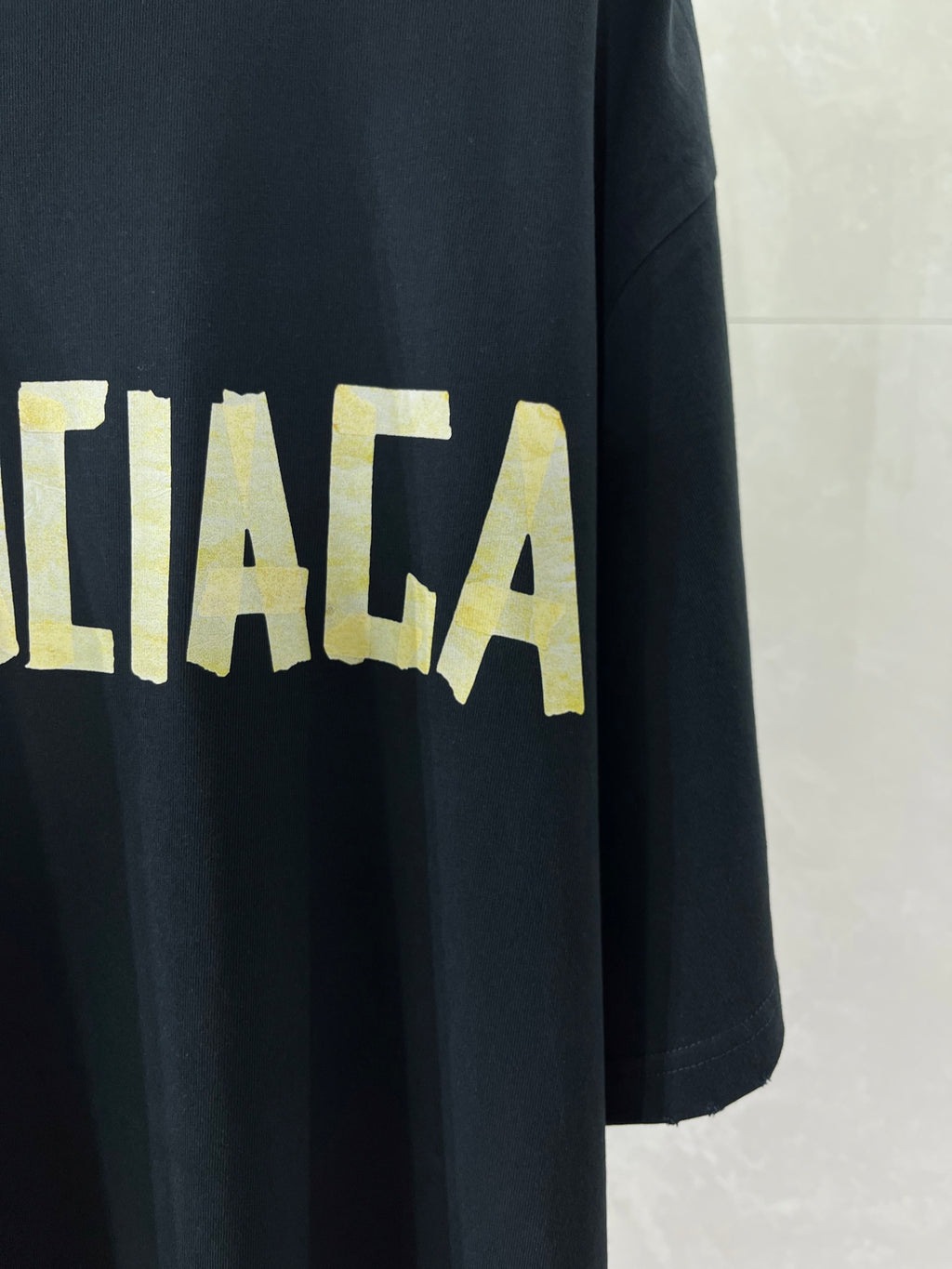 Balenciaga crewneck T-shirt, dark navy, yellow BALENCIAGA lettering across front