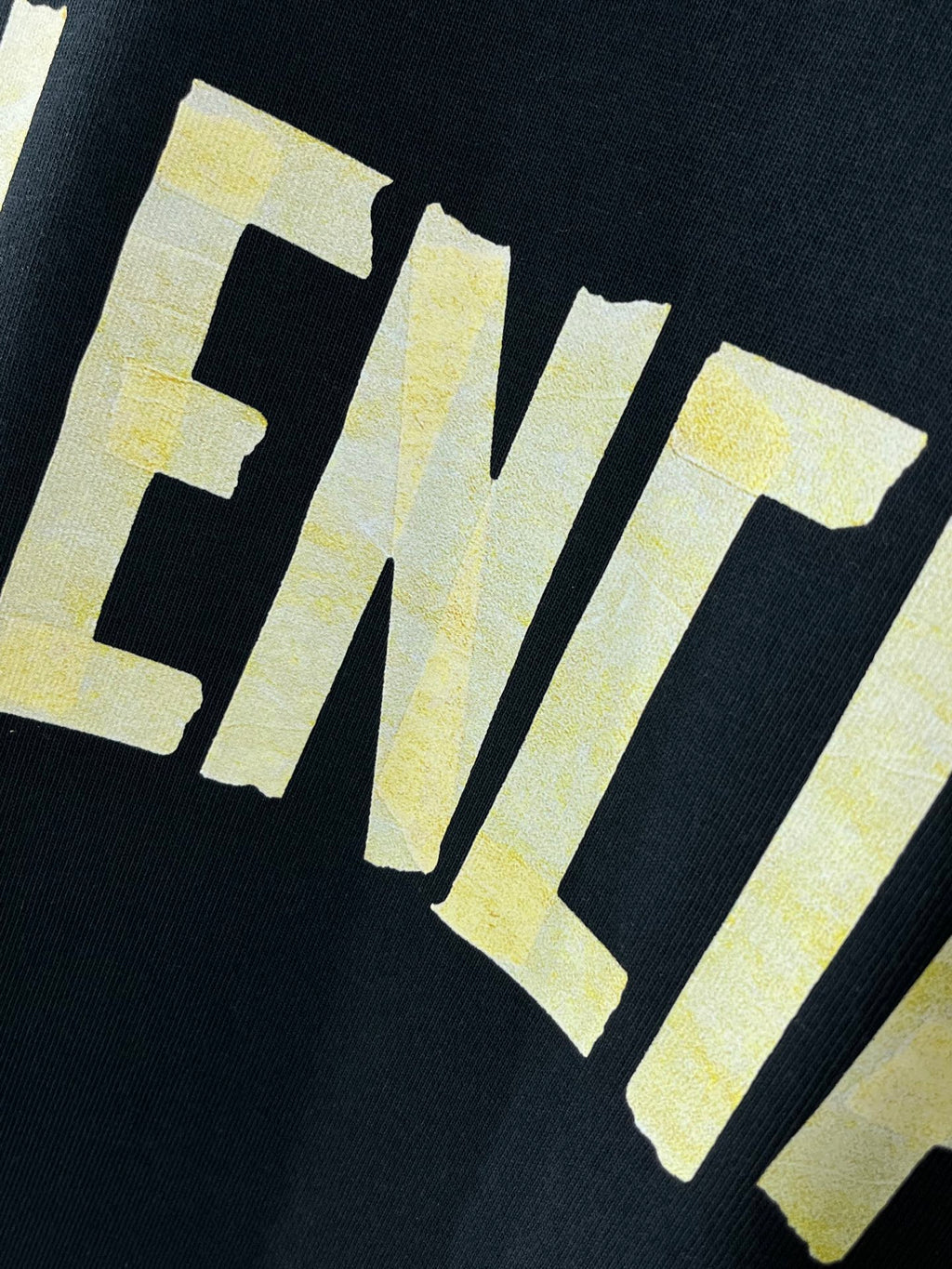 Balenciaga crewneck T-shirt, dark navy, yellow letters logo graphic close-up