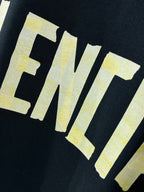 Balenciaga crewneck T-shirt, dark navy, yellow letters logo graphic close-up