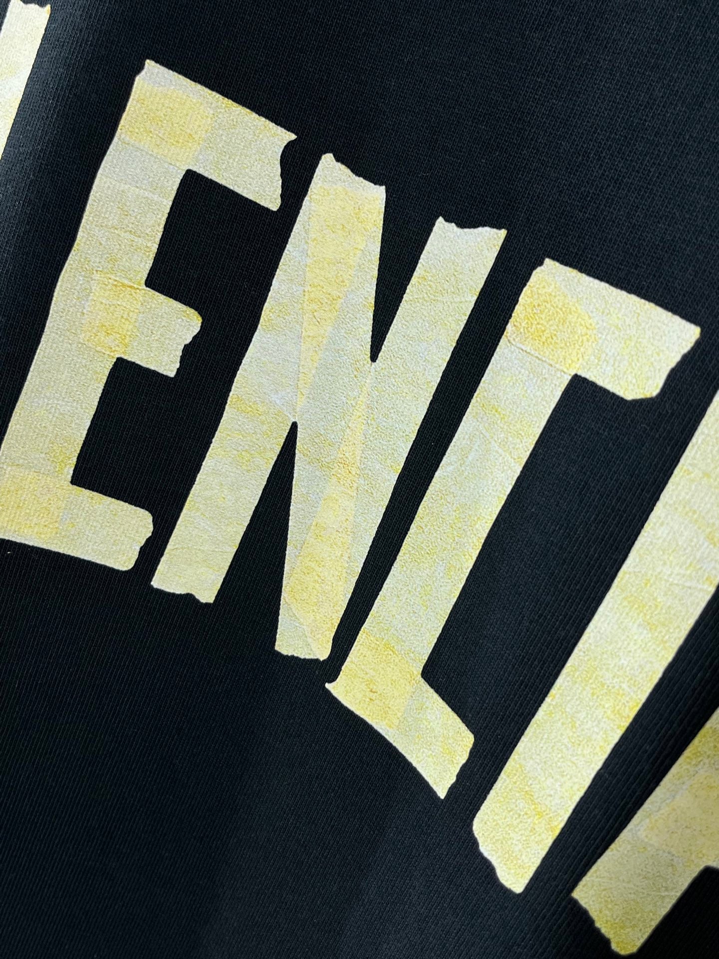 Balenciaga crewneck T-shirt, dark navy, yellow letters logo graphic close-up