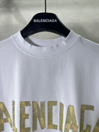White crewneck Balenciaga T-shirt close-up of neckline and gold text print