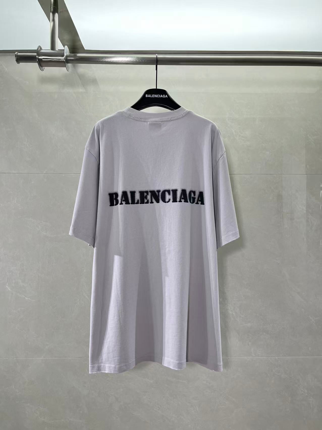 Light lavender Balenciaga T-shirt with black logo print on back, crew neck
