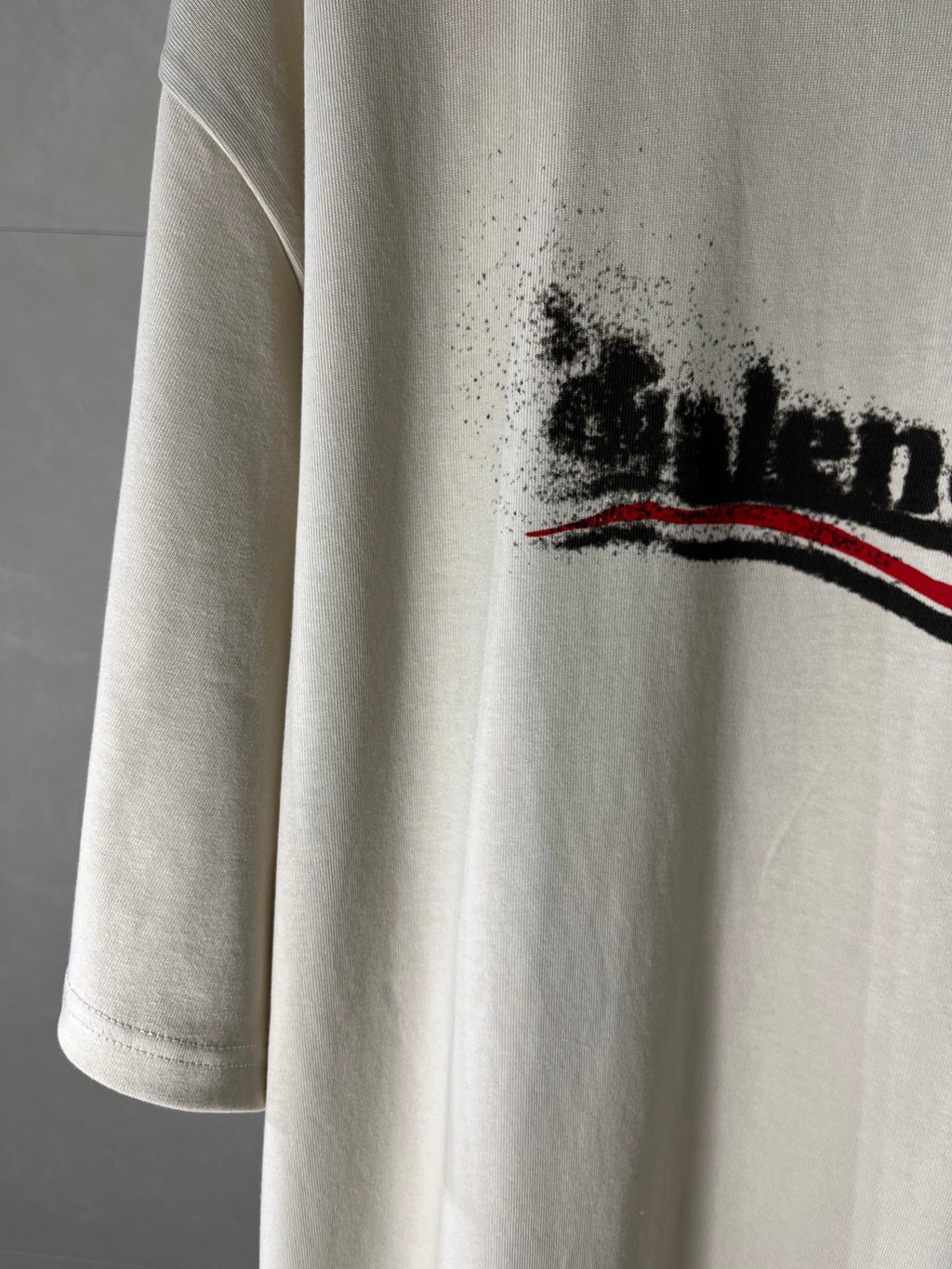 Balenciaga light cream T-shirt sleeve with partial front logo graphic