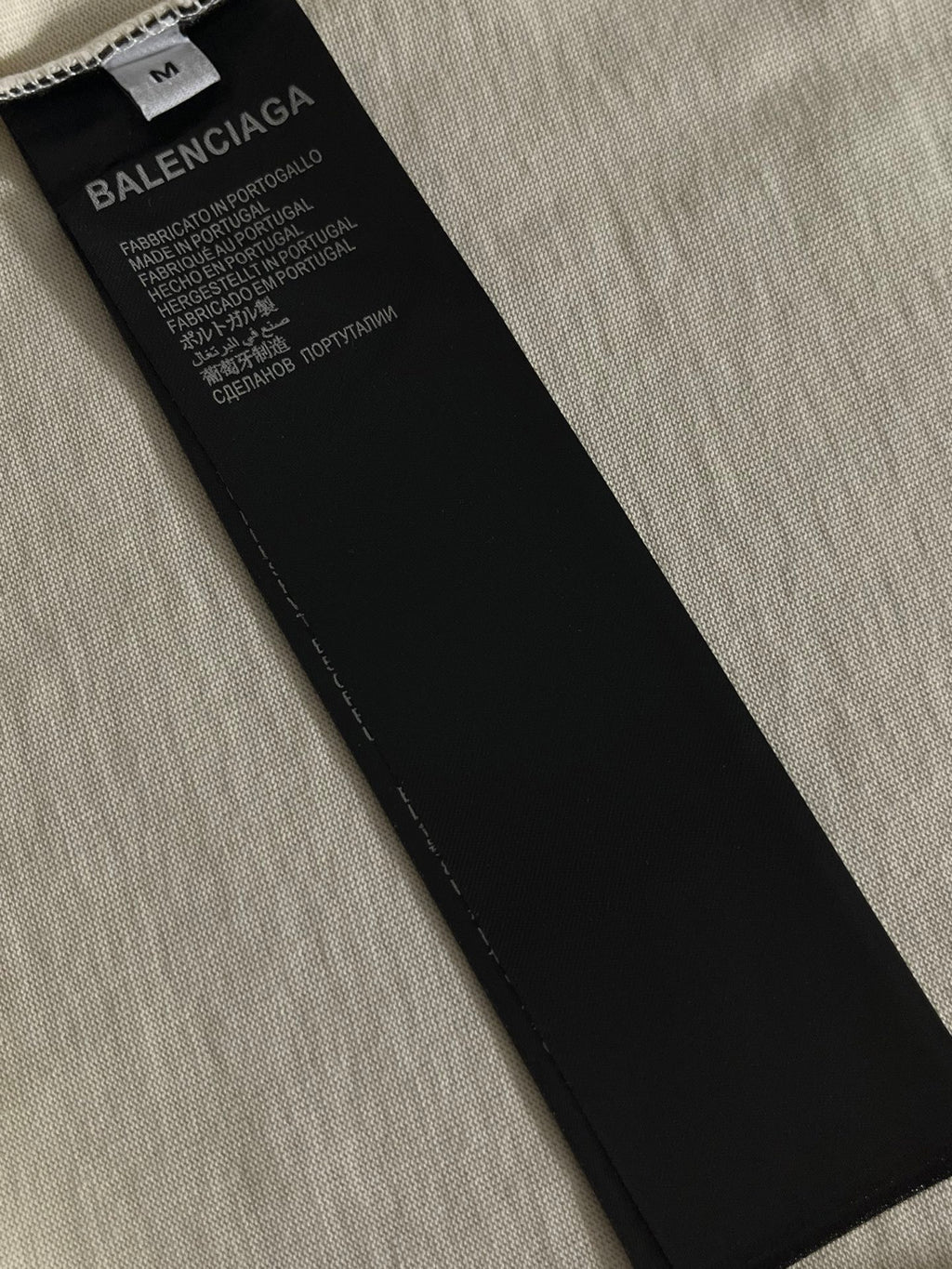 Balenciaga black neck label with white printed care and fabric text