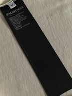 Balenciaga black neck label with white printed care and fabric text