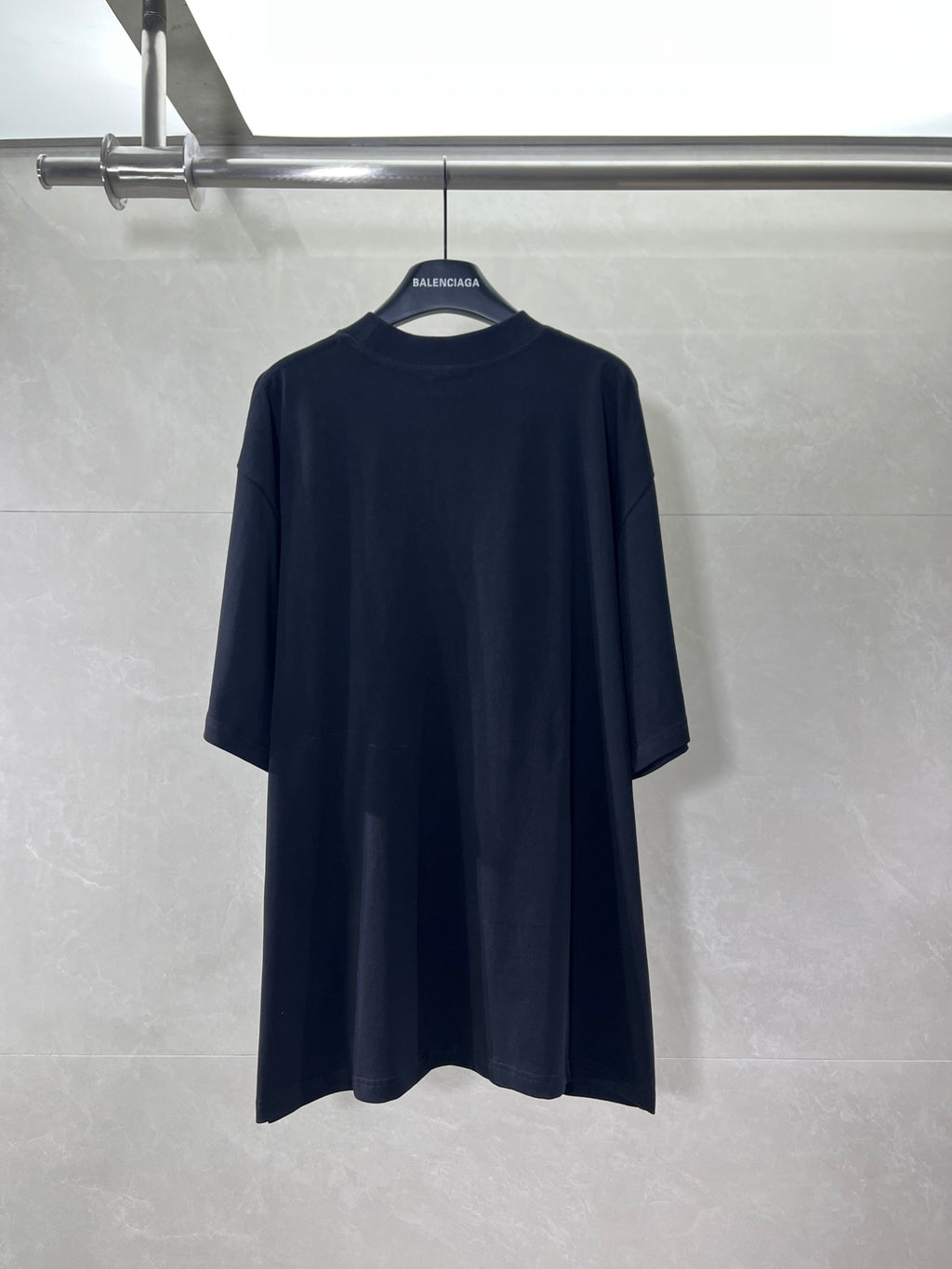 Black crew-neck T-shirt with short sleeves, plain back