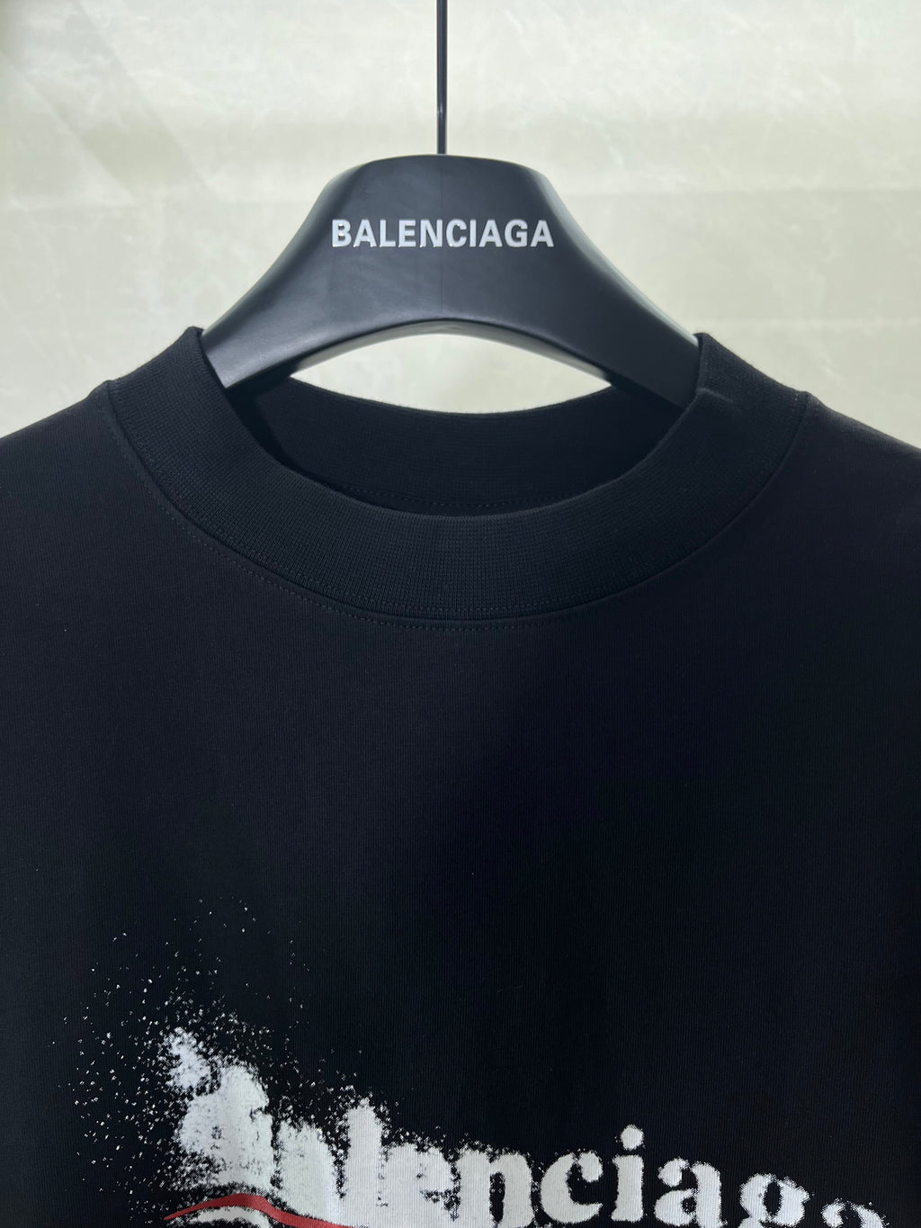 Close-up of black crew-neck T-shirt neckline