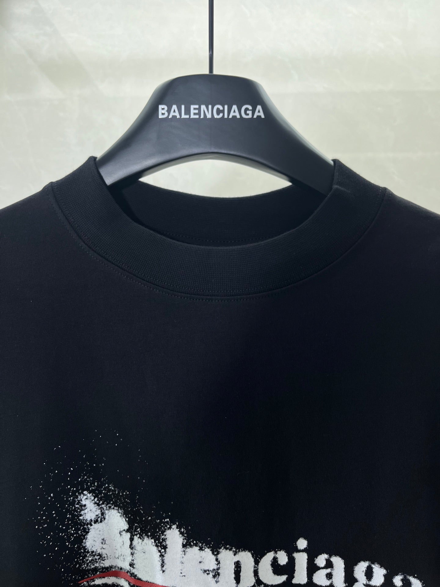 Close-up of black crew-neck T-shirt neckline