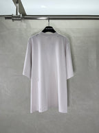 White Balenciaga T-shirt back view with small stitched details near shoulders
