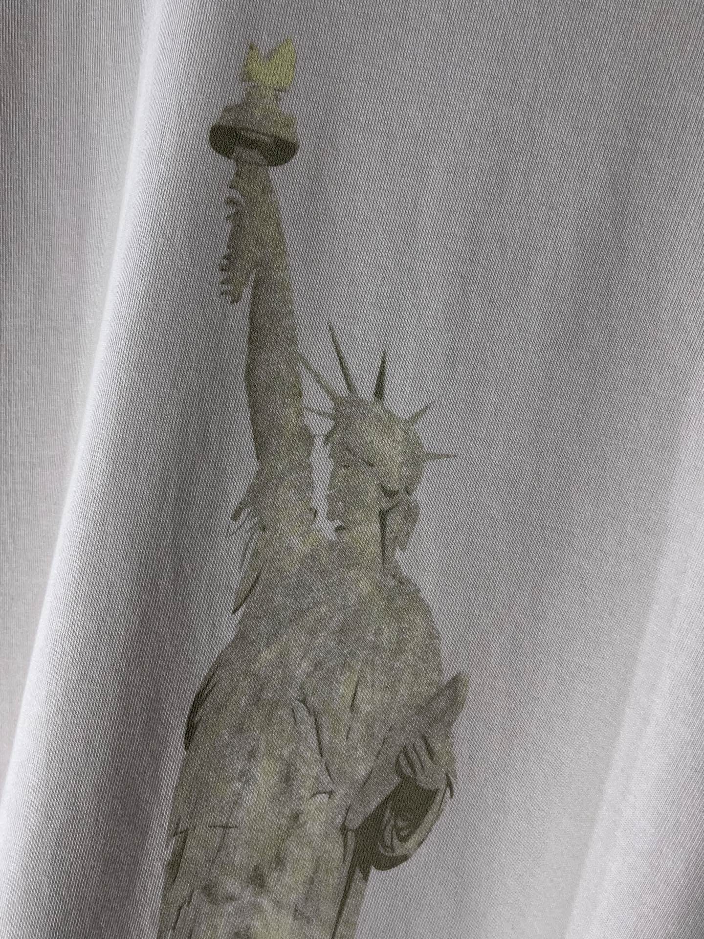 White Balenciaga T-shirt close-up of statue graphic on the chest