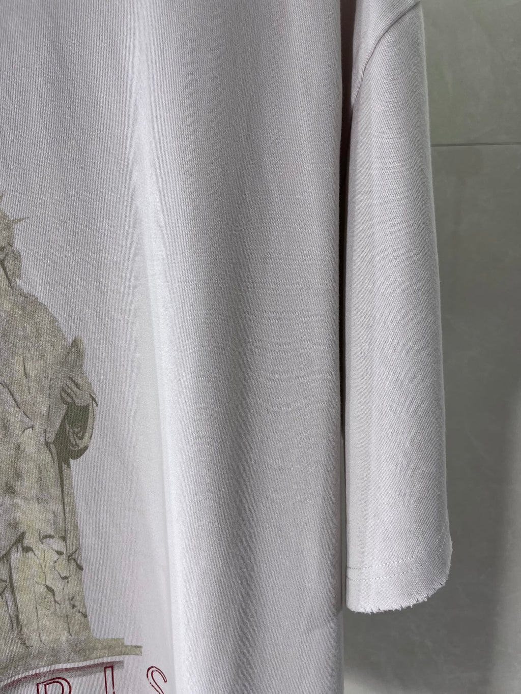 White Balenciaga T-shirt lower front with partial Paris typography graphic at left