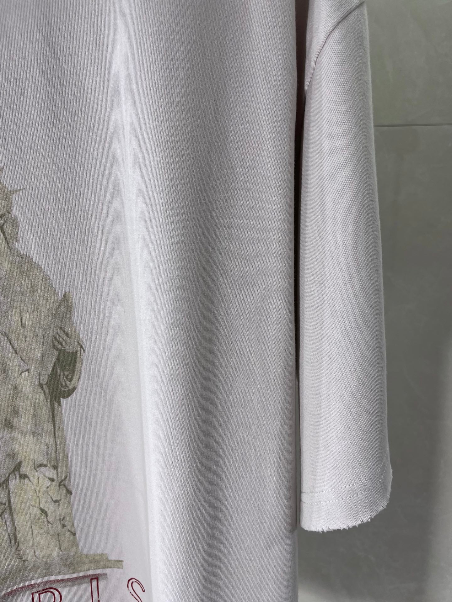 White Balenciaga T-shirt lower front with partial Paris typography graphic at left