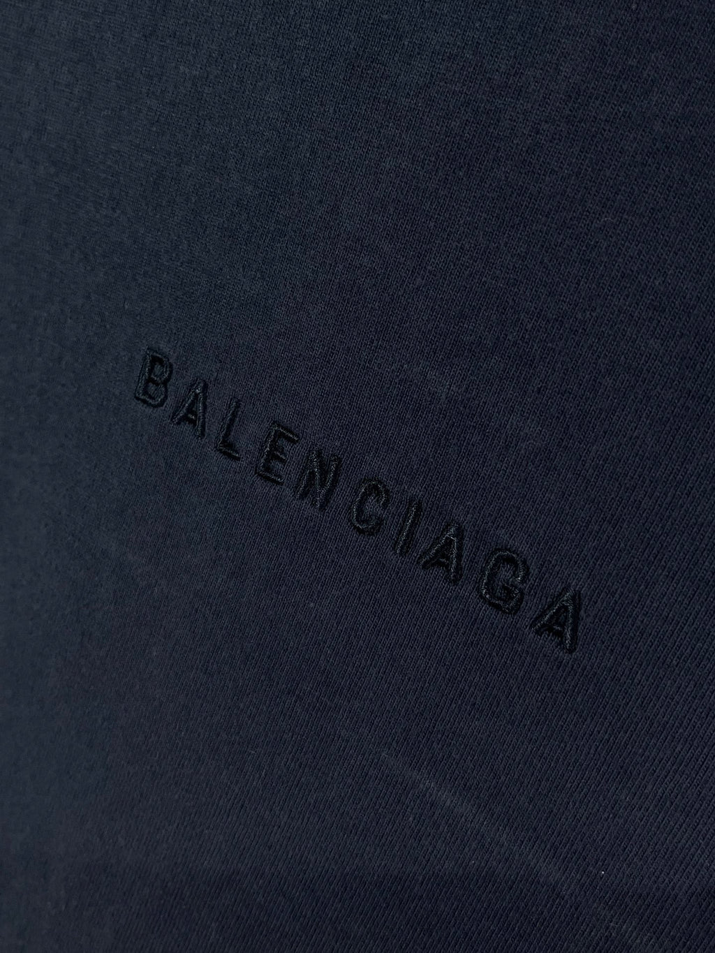 Navy Balenciaga T-shirt fabric with 'BALENCIAGA' text stitched across