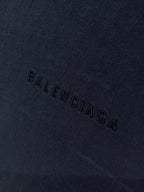 Navy Balenciaga T-shirt fabric with 'BALENCIAGA' text stitched across