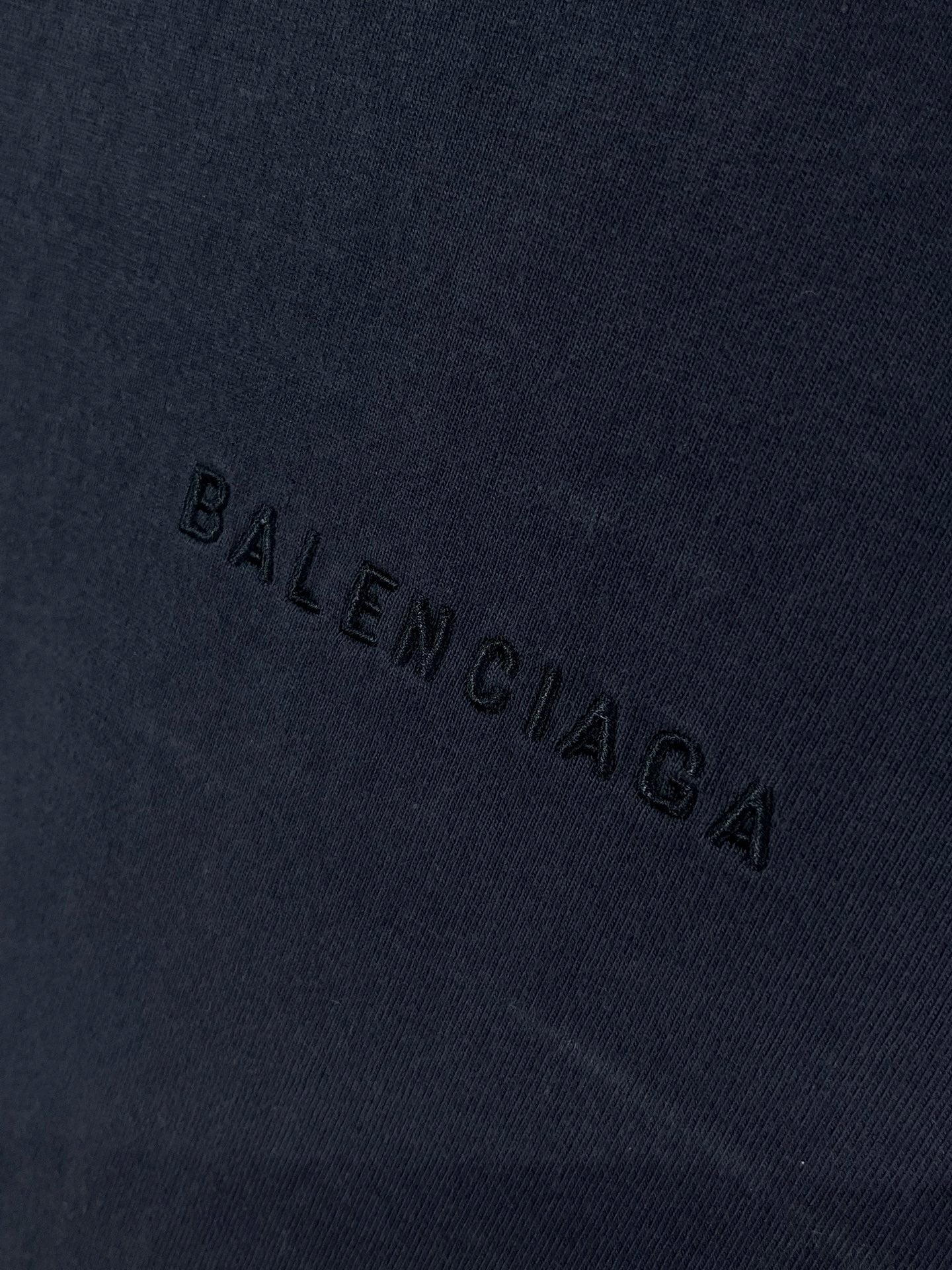 Navy Balenciaga T-shirt fabric with 'BALENCIAGA' text stitched across