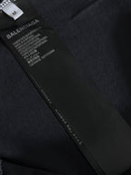Balenciaga T-shirt care label and size tag on dark fabric