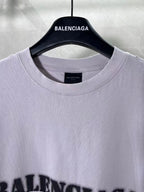 Light lavender Balenciaga T-shirt neckline close-up with small neck label