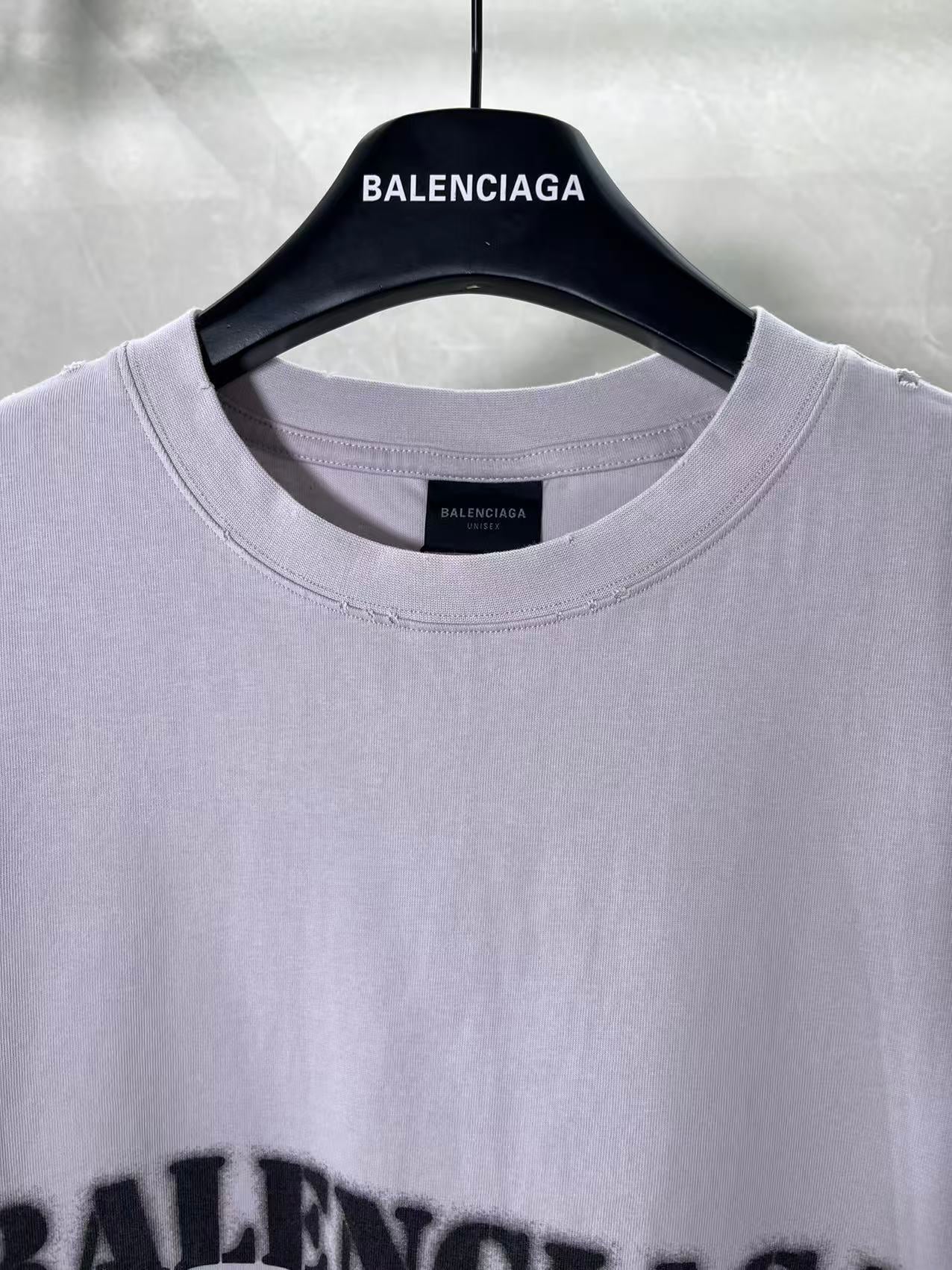 Light lavender Balenciaga T-shirt neckline close-up with small neck label