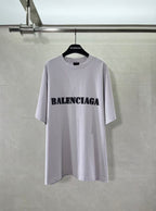 Light lavender Balenciaga T-shirt with black chest logo print, crew neck
