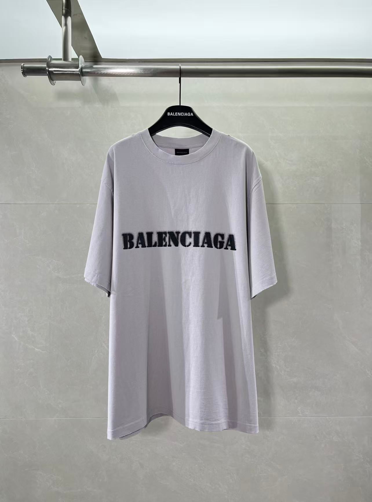 Light lavender Balenciaga T-shirt with black chest logo print, crew neck