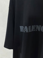 Dark T-shirt with large BALENCIAGA logo print on side panel.