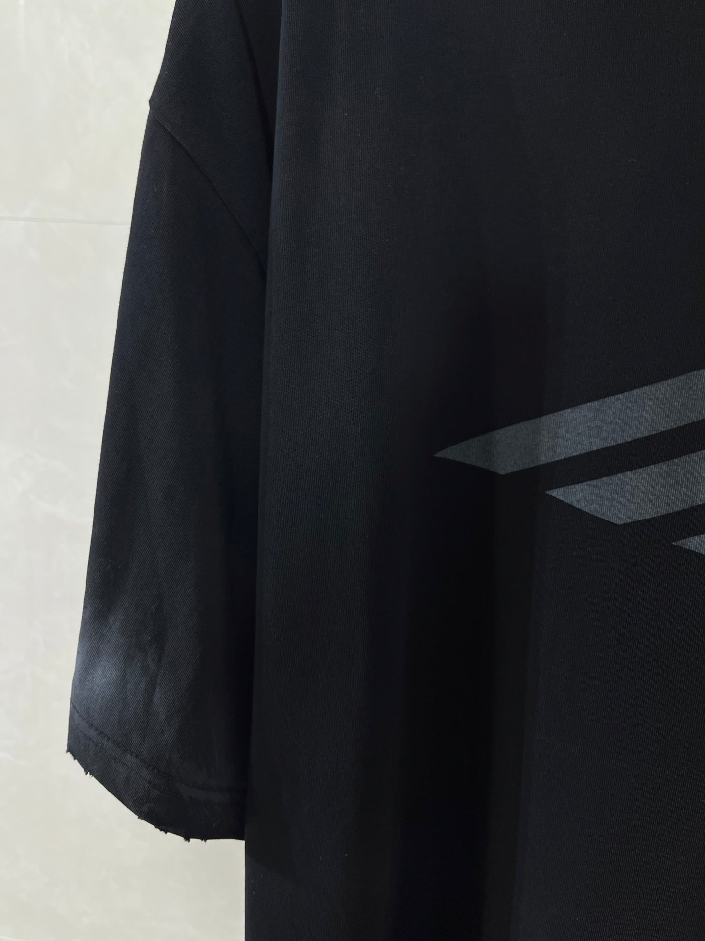 Balenciaga dark navy T-shirt side view with logo print